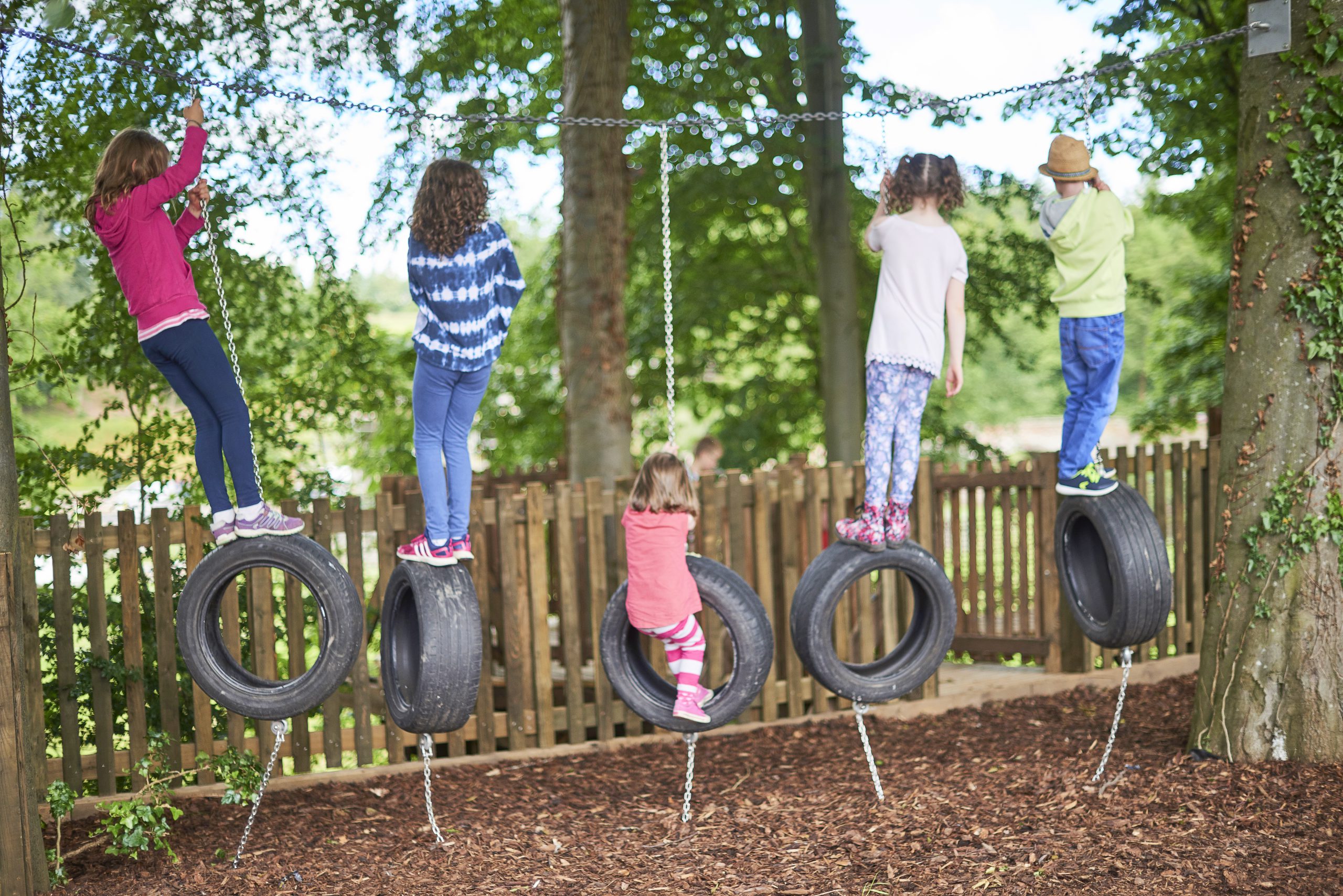 Child engaging in sensory play outdoors